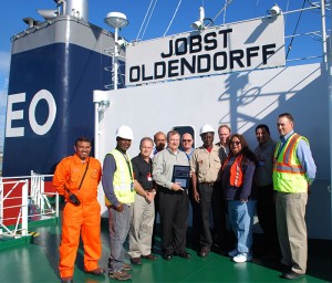 Photo caption from left to right: Shihan Mohamed (vessel chief) Chief Officer Shawn Robinson (SGS), Ken McLaughlin (KMBT), Capt. Russell D’Souza (Oldendorff), Mike Schiller (POV), Chris Cummins (PNW Ship & Cargo), Captain Baisie (vessel captain), David Nagel (SGS), Sandra Avila (PNW Ship & Cargo), Noa Lidstone (KMBT), Steve Mickelson (POV)